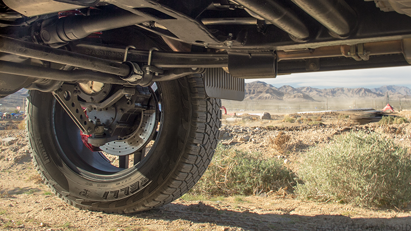 See that gear behind the brake? That’s the portal axle, it allows the axle to be mounted much higher than usual. (Image: Mark Victor Arnold)